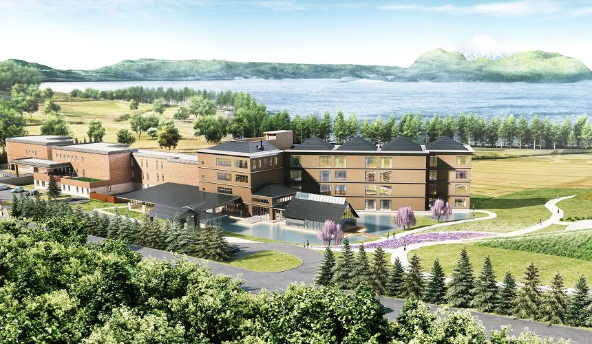 洞爺湖鶴雅度假區洸之謌全景,建築群位於洞爺湖畔草地中,前方可見湖面與遠山,呈現結合自然景觀的湖畔度假型飯店