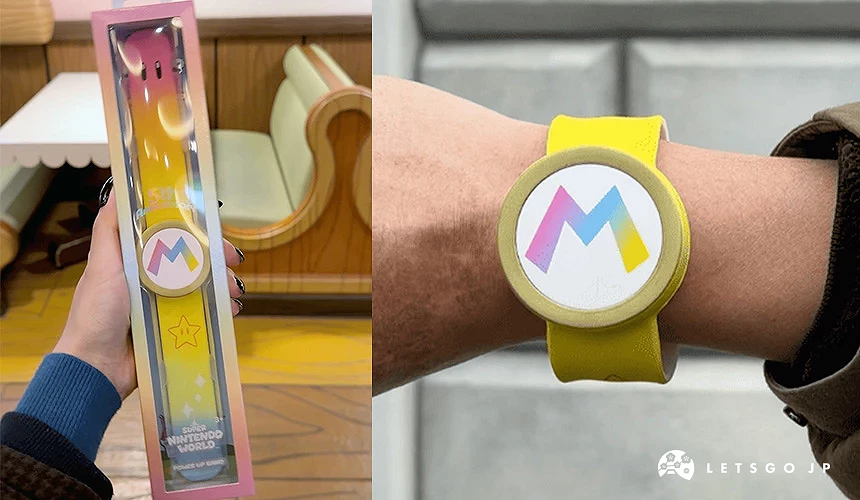 中間寫著「M」字樣的彩色手錶