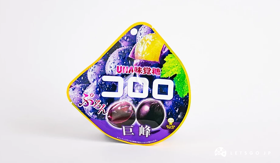 深紫色半圓形包裝袋,印有コロロ字樣與巨峰葡萄圖案